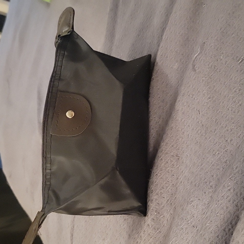 Black cosmetic bag, waterproof.  NWOT.